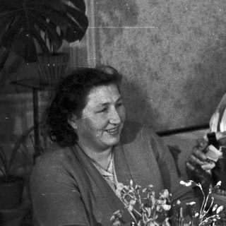 Black and white photo of a couple indoors, smiling.