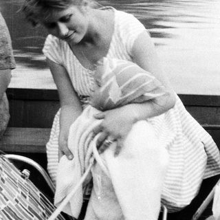 Diana, Princess of Wales, sits on a boat.