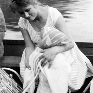 Diana, Princess of Wales, sits on a boat.
