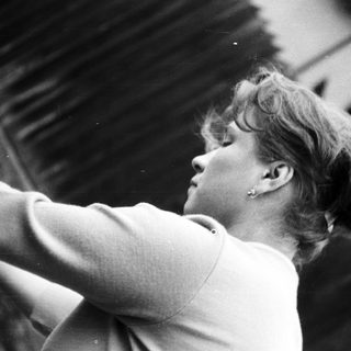 Black and white portrait of a woman with short hair.