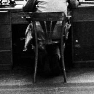 Operator monitors equipment in a control room.