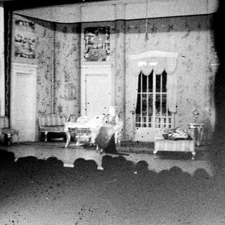 Black and white photograph of a room set design.