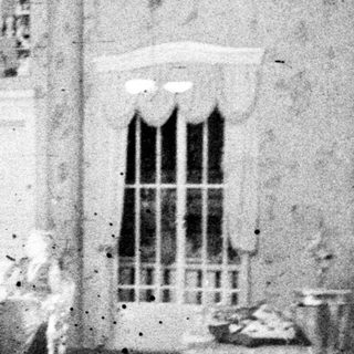 Black and white photograph of a room set design.