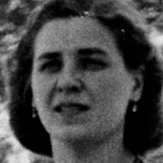Black and white photo of a girl and woman standing outside.