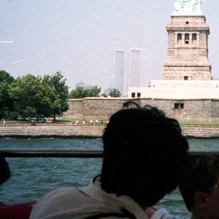 The Statue of Liberty is seen from a boat.