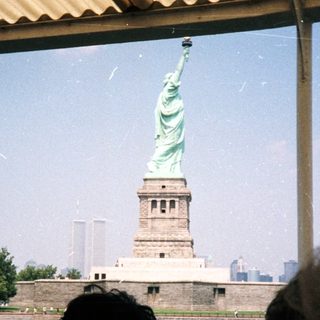 The Statue of Liberty is seen from a boat.