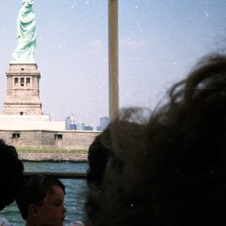 The Statue of Liberty is seen from a boat.