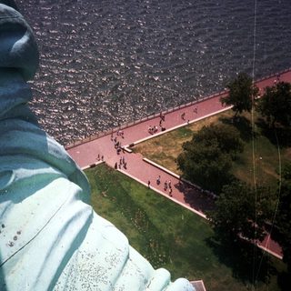 View from the Statue of Liberty overlooking a park and water.