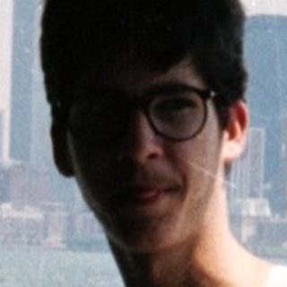 Person on a ferry with a New York City skyline view.