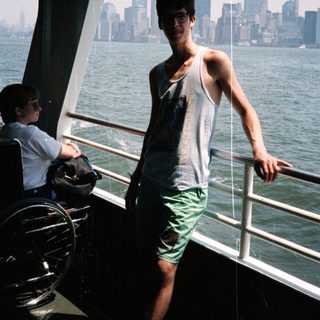 Person on a ferry with a New York City skyline view.