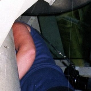 Close-up view of a large, curved, metal structure.