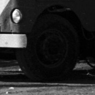 Large truck transporting aircraft engine section.