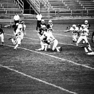 American football game action during play.