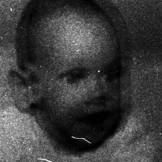 Vintage framed photograph of a young child.