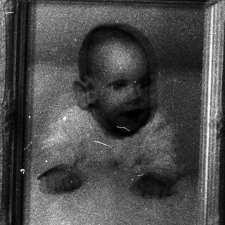 Vintage framed photograph of a young child.
