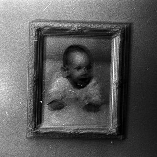 Vintage framed photograph of a young child.