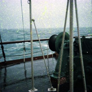 Rainy deck on a ship at sea.