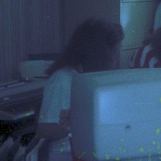 Blurry indoor scene with "Love" written in glittery letters.