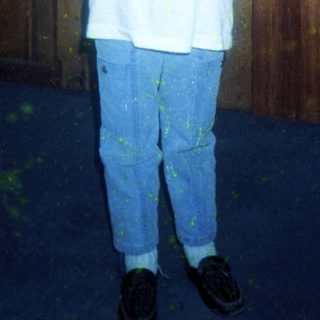 Young boy wearing "First Mate" T-shirt and jeans.