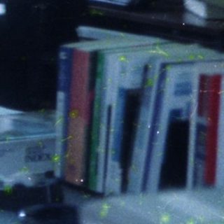 Child standing in messy, painted room.