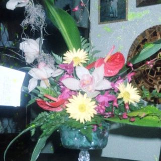 Elegant floral arrangement in vintage vase on table.