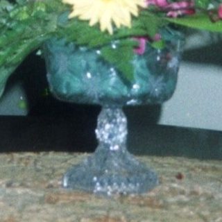 Elegant floral arrangement in vintage vase on table.