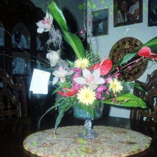 Elegant floral arrangement in vintage indoor setting.