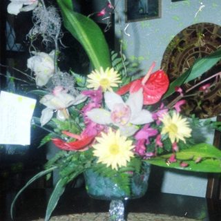 Elegant floral arrangement in vintage indoor setting.
