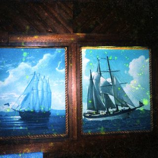 Two vintage sailing ships depicted in framed paintings.