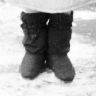 Family portrait in winter clothing outdoors.