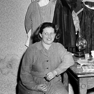 Vintage clothing shop with man and woman posing.