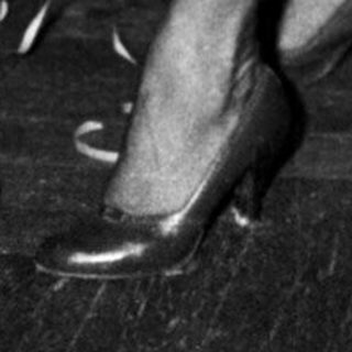 Couple dancing at a formal event.