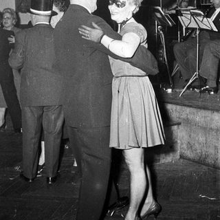 Couple dancing at a formal event.
