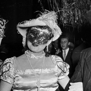 Costumed couple at formal evening event.