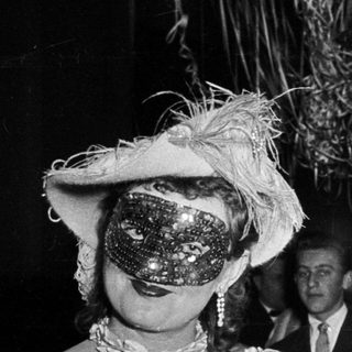 Costumed couple at formal evening event.