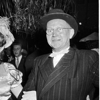 Costumed couple at formal evening event.