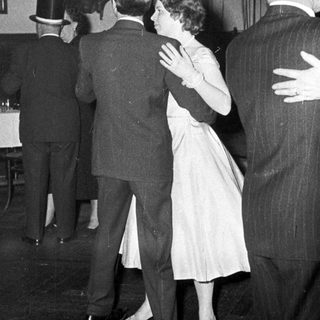 People dancing at a formal evening event.