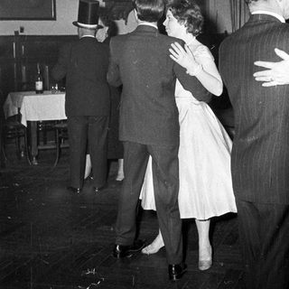 People dancing at a formal evening event.