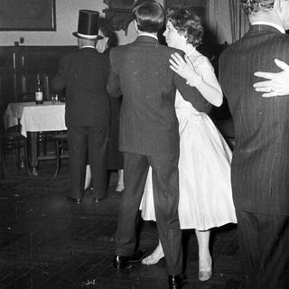 People dancing at a formal evening event.