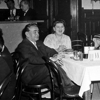 Group of people dining together in a restaurant.