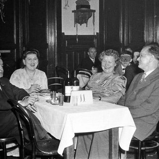 Group of people dining together in a restaurant.