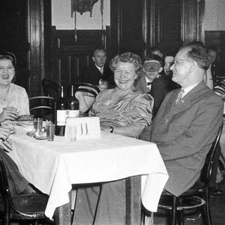 Group of people dining together in a restaurant.