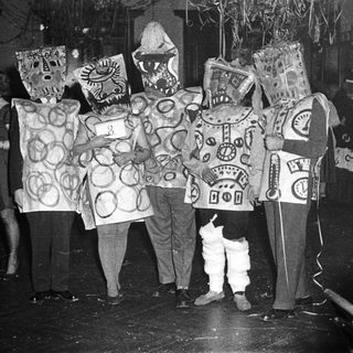 Costumed group performing in festive or theatrical event.