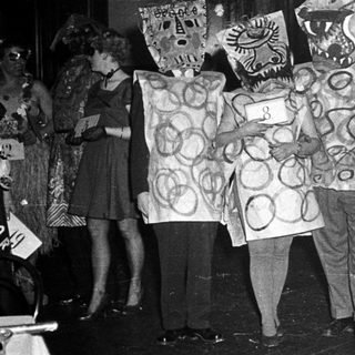Costumed group performing in festive or theatrical event.