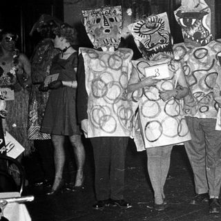 Costumed group performing in festive or theatrical event.