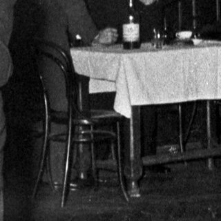 Couple dancing at a formal evening event.