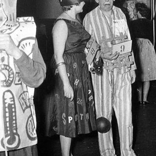 Costumed individuals at a 1930s-40s themed event or party.