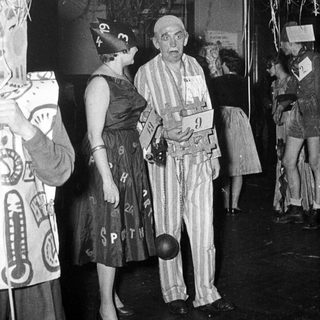 Costumed individuals at a 1930s-40s themed event or party.