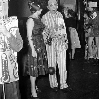 Costumed individuals at a 1930s-40s themed event or party.