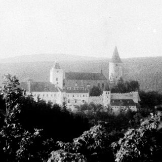 Historic castle perched on elevated terrain.